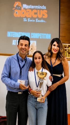Mastermind Abacus students and franchise team at an international competition award ceremony