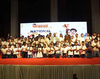 Group photo of student winners on stage at the National competition