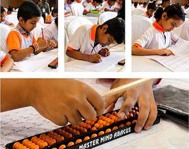 Close-up of students practising on the abacus during class